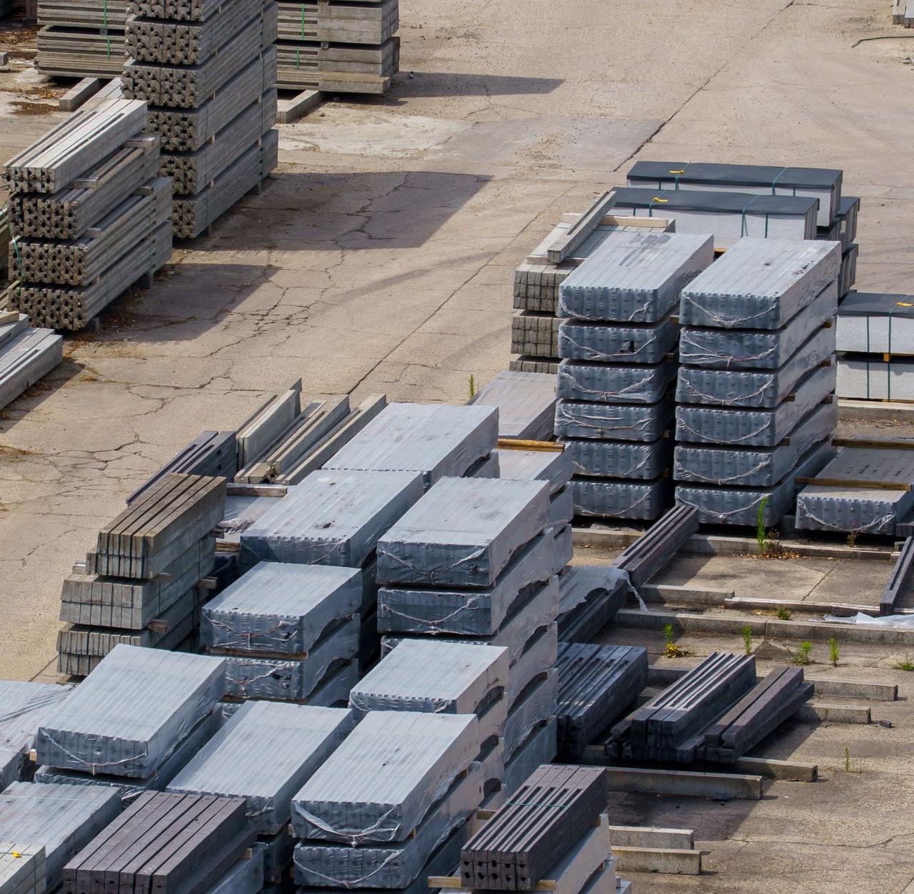 Aerial view of stacked concrete blocks in an industrial yard in Dessel, Belgium.
