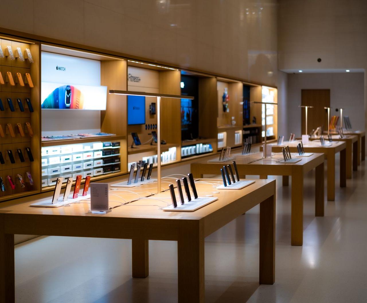 Sleek interior of a high-tech store showcasing various mobile devices and accessories.